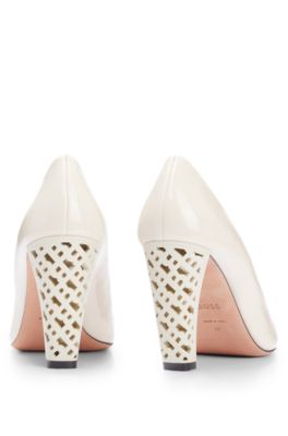 Leather pumps with monogram-patterned heels, White