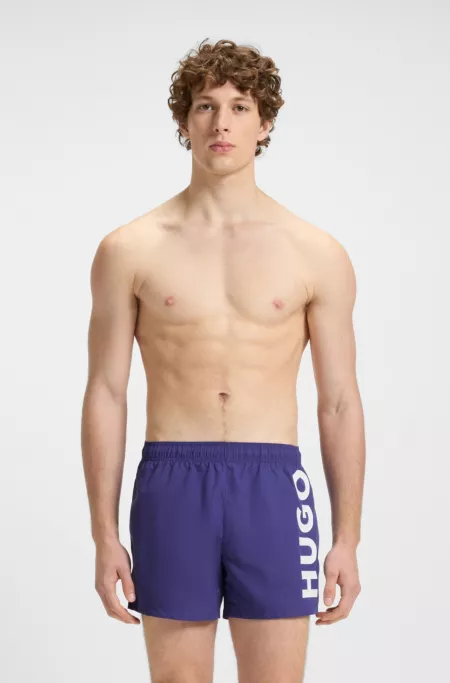 Swim shorts with vertical logo print