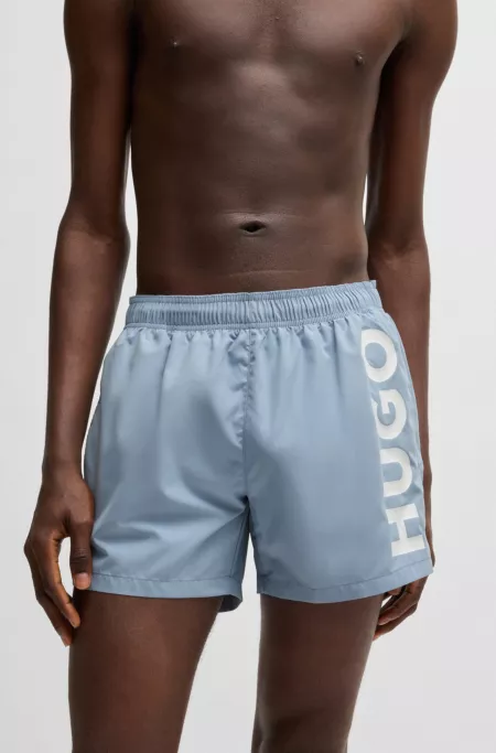 Swim shorts with vertical logo print