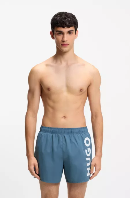 Swim shorts with vertical logo print