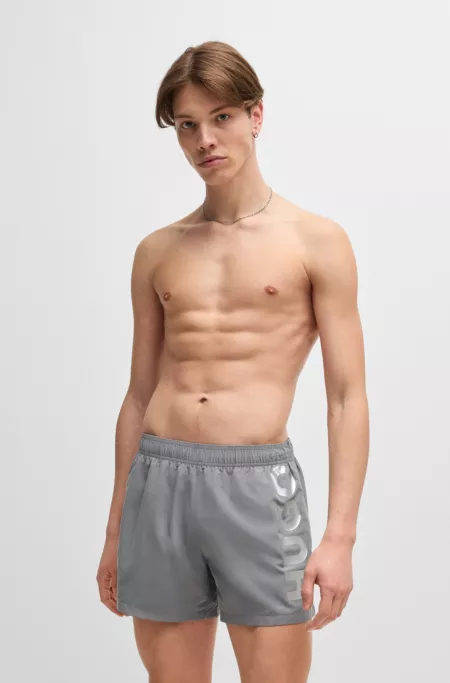 Fully lined swim shorts with vertical logo