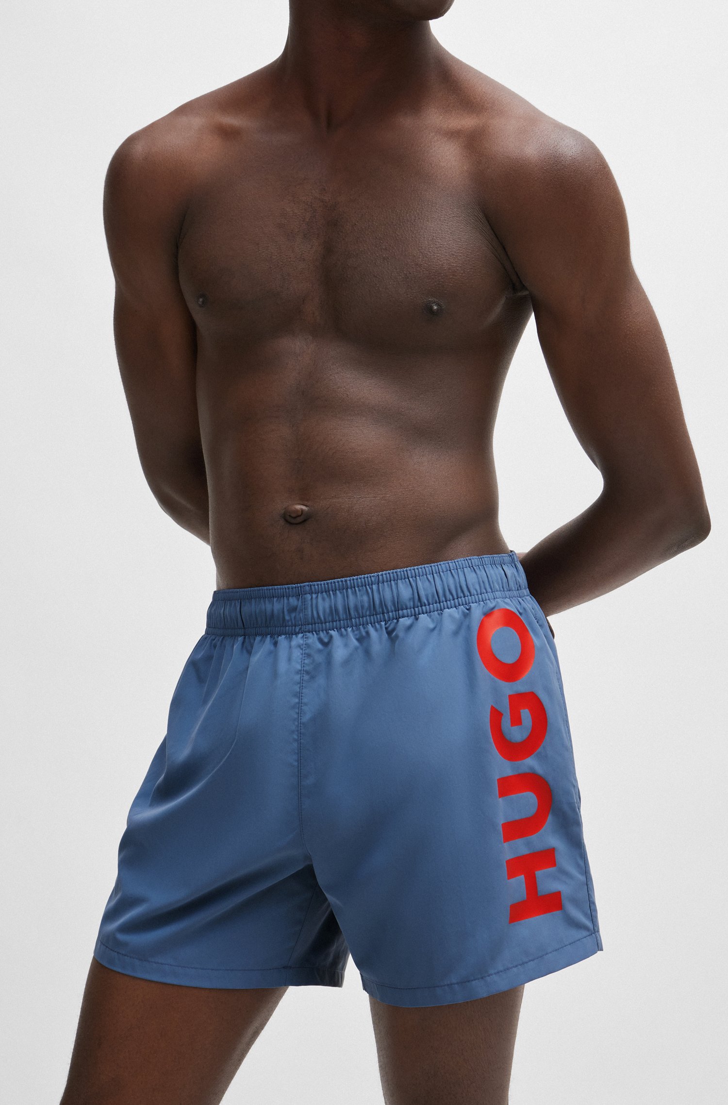 Fully lined swim shorts with vertical logo