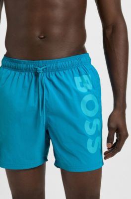 Quick-dry swim shorts with vertical logo print, Turquoise