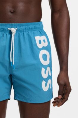 Quick-drying swim shorts with printed logo, Turquoise