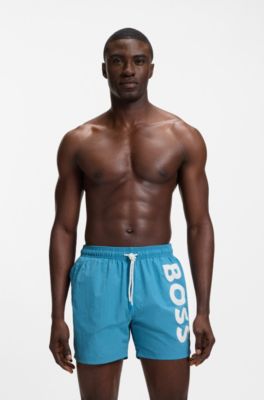 Quick-drying swim shorts with printed logo, Turquoise