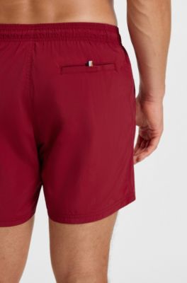 Quick-dry swim shorts with vertical logo print, Red