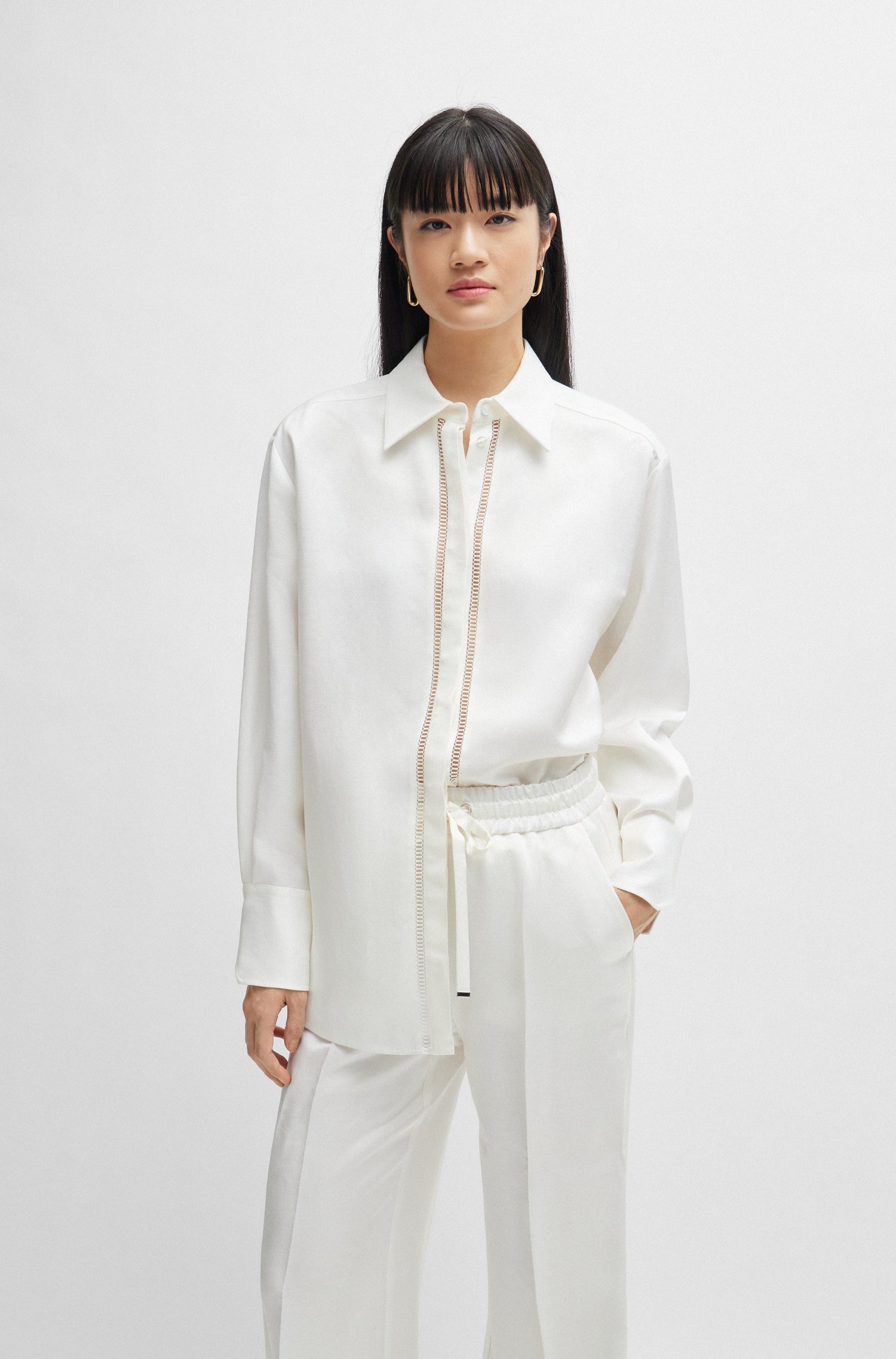 Long-sleeved blouse with ladder-lace trim