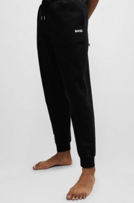 BOSS - Tracksuit bottoms with stripes and logos - Black