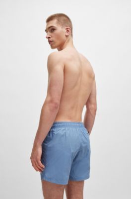 Ba&ntilde;ador tipo shorts con forro integral y logo estampado, Celeste