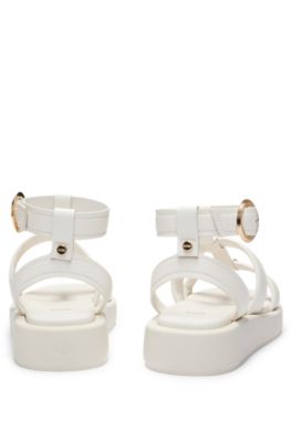 Platform leather sandals with branded buckle closure, White