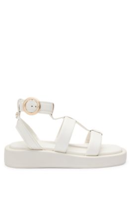 Platform leather sandals with branded buckle closure, White