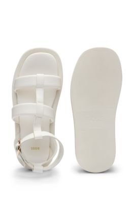Platform leather sandals with branded buckle closure, White