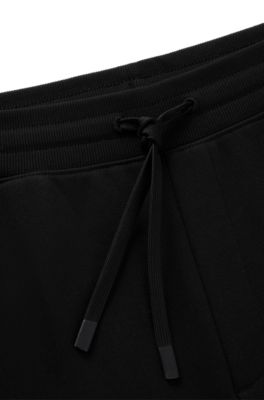 Cotton-terry tracksuit bottoms with logo print, Black