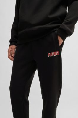 Cotton-terry tracksuit bottoms with logo print, Black