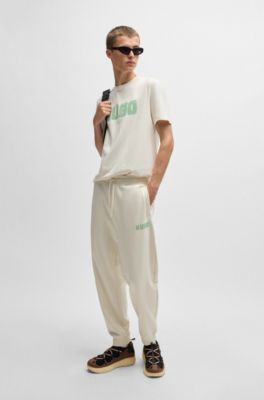 Cotton-terry tracksuit bottoms with logo print, White
