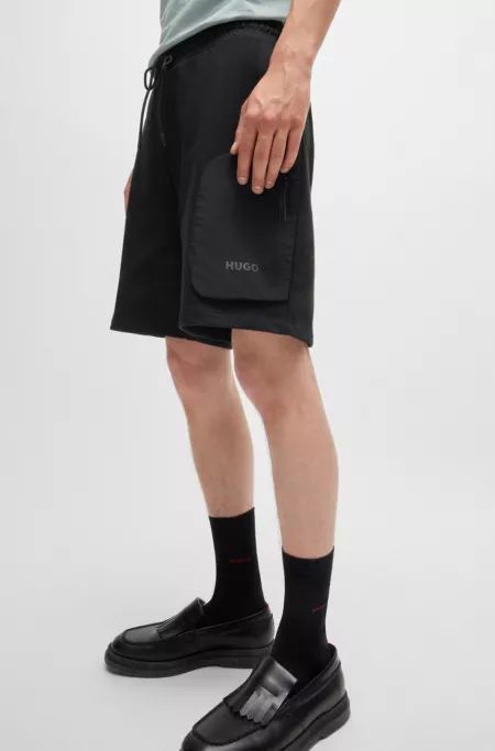 Cotton-terry relaxed-fit shorts with logo print