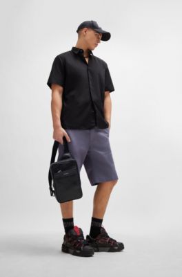 Logo-trim backpack in perforated faux leather, Black