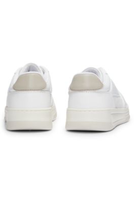 Leather trainers with suede trims and perforations