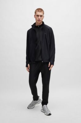 Tracksuit bottoms in stretch fabric with decorative reflective logo, Black