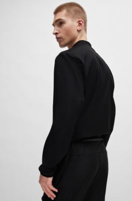 Tracksuit bottoms in stretch fabric with decorative reflective logo, Black