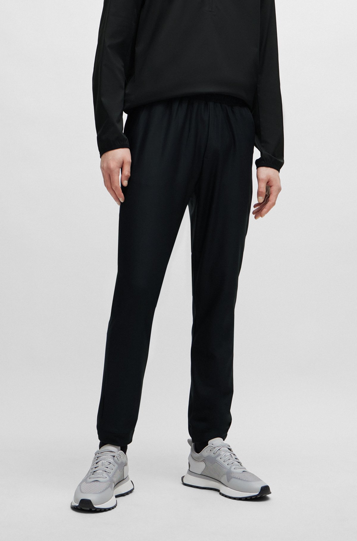 BOSS - Tracksuit bottoms in stretch fabric with decorative reflective logo