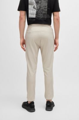 Tracksuit bottoms in stretch fabric with decorative reflective logo, Light Beige