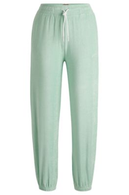 Hugo Boss Cuffed Tracksuit Bottoms In Terry Fabric With Handwritten Logo In Light Green