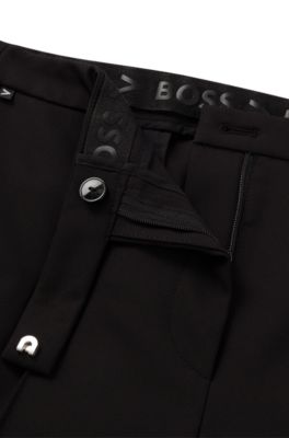 Pantalones de tejido el&aacute;stico t&eacute;cnico con pernera estrecha, Negro