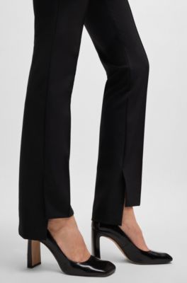 Pantalones de tejido el&aacute;stico t&eacute;cnico con pernera estrecha, Negro