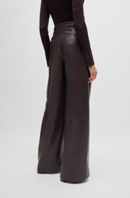 Pleat-front relaxed-fit trousers in faux leather, Light Red