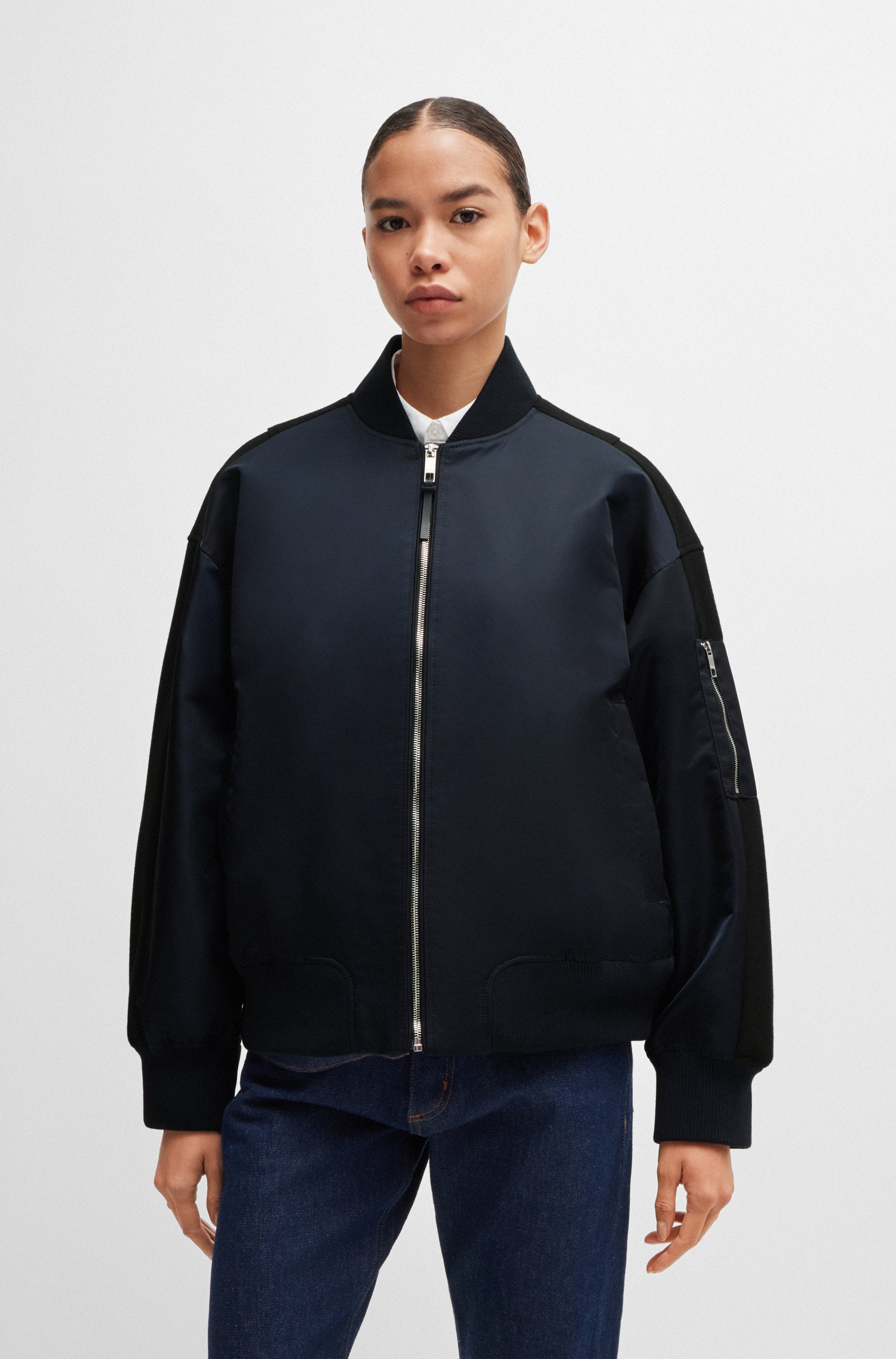 Water-repellent bomber jacket with zipped sleeve pocket