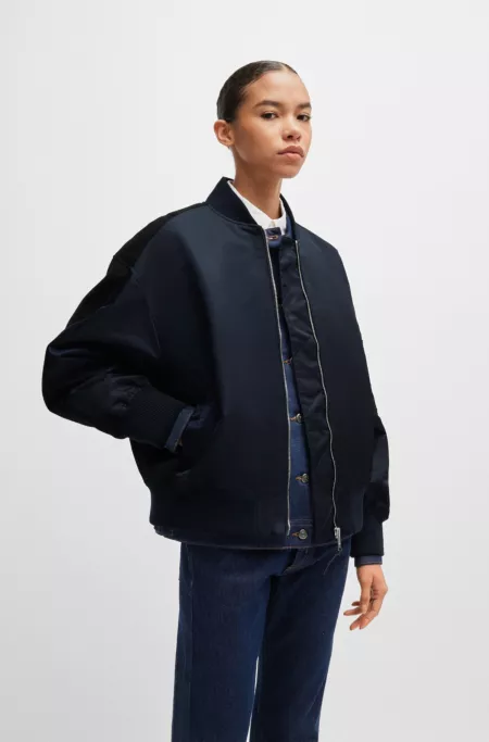 Water-repellent bomber jacket with zipped sleeve pocket
