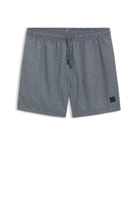 Printed swim shorts with logo badge