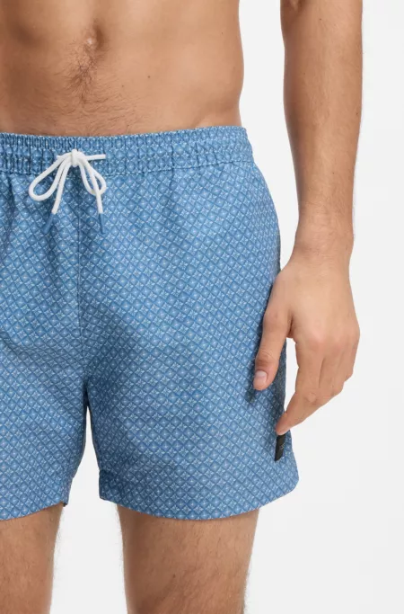 Micro-print swim trunks with logo patch