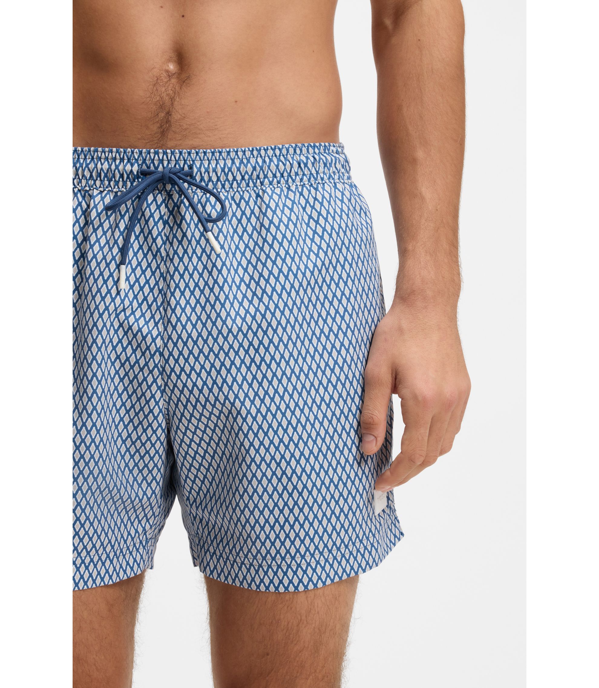 BOSS - Printed swim shorts with logo badge - Light Blue