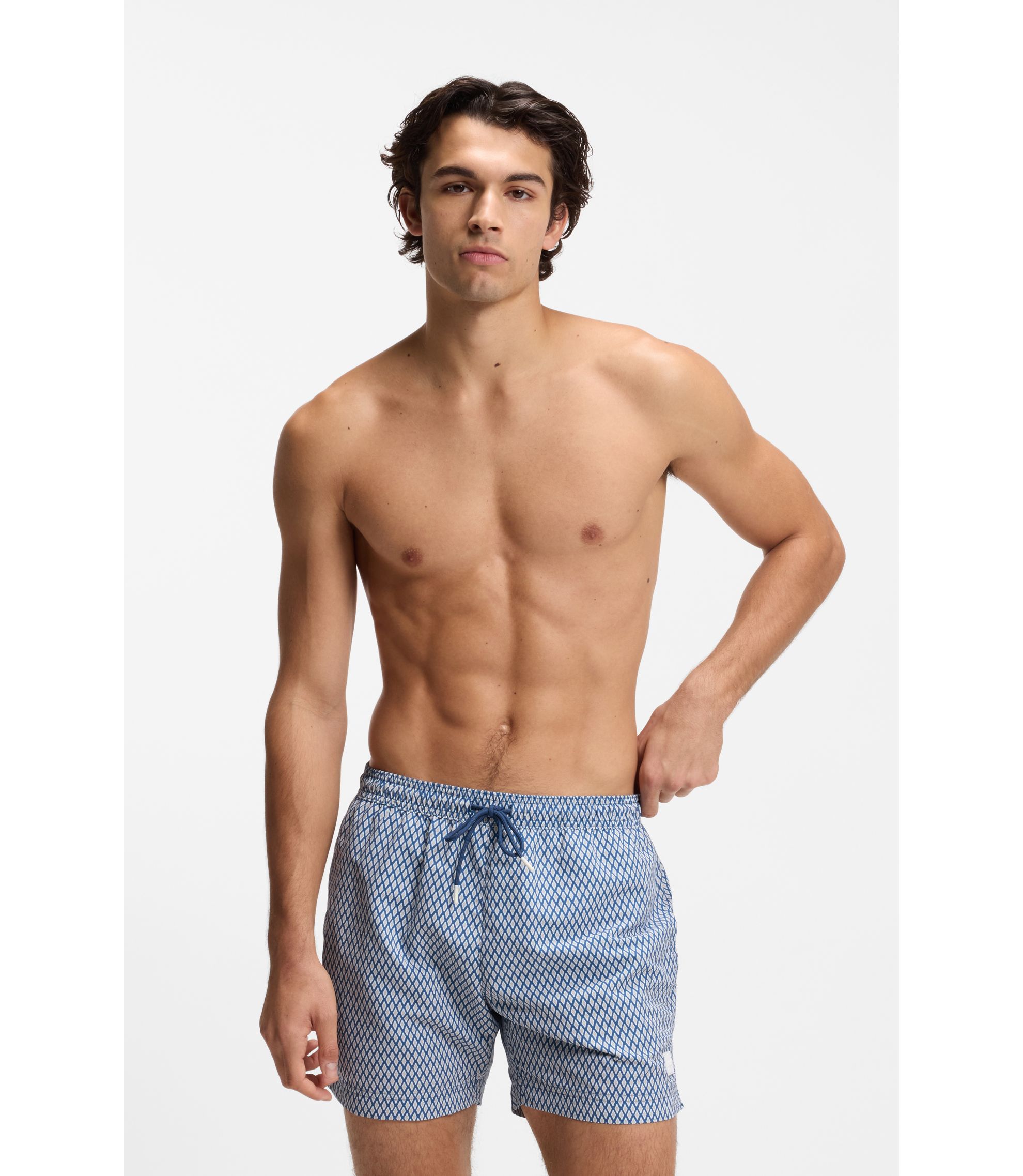 BOSS - Printed swim shorts with logo badge - Light Blue