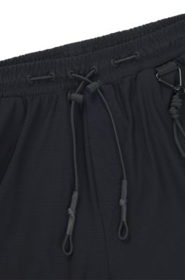 Bas de surv&ecirc;tement Regular en tissu performant &agrave; s&eacute;chage rapide, Noir