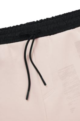 Tracksuit bottoms with seasonal artwork, White