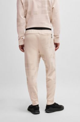 Tracksuit bottoms with seasonal artwork, White