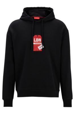 Shop Hugo Cotton-terry Hoodie With Travel-tag Artwork In Black