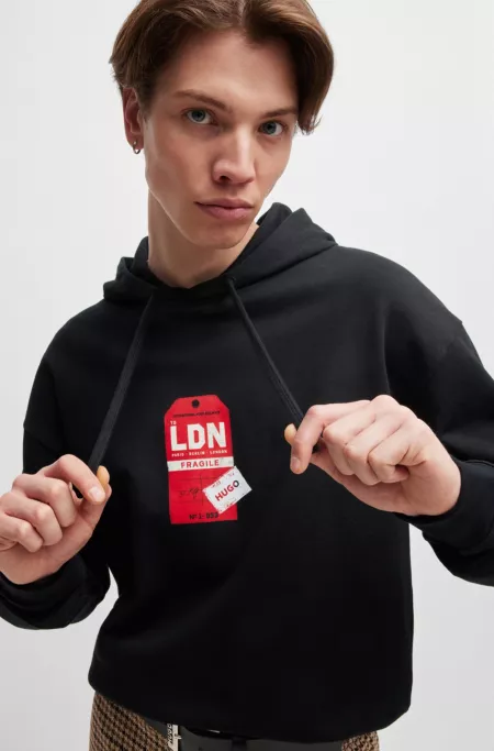 Cotton-terry hoodie with travel-tag artwork