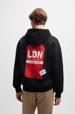 Cotton-terry hoodie with travel-tag artwork, Black