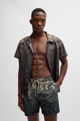 Quick-dry swim shorts with seasonal print
