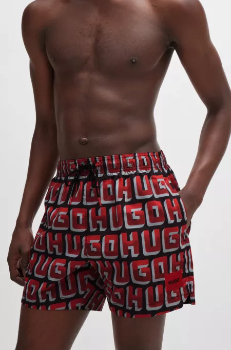 Quick-dry swim shorts with all-over logo print