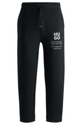 Hugo Boss Relaxed-fit Tracksuit Bottoms With Logo And Slogans In Black