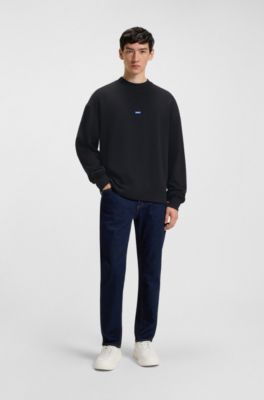 HUGO - Cotton-terry sweatshirt with blue logo patch - Black