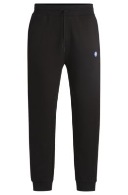 Shop Hugo Cotton-terry Tracksuit Bottoms With Smiley-face Logo Patch In Black