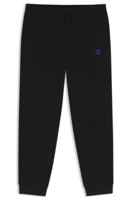 Cotton-terry tracksuit bottoms with Happy HUGO, Black