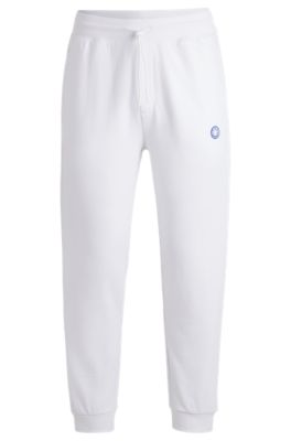 Cotton-terry tracksuit bottoms with Happy HUGO, White