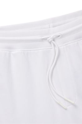 Cotton-terry tracksuit bottoms with Happy HUGO, White